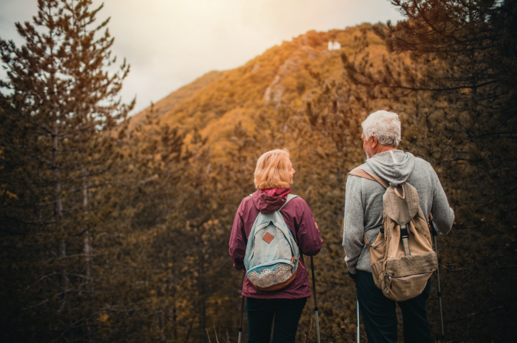 Two people walking away from camera