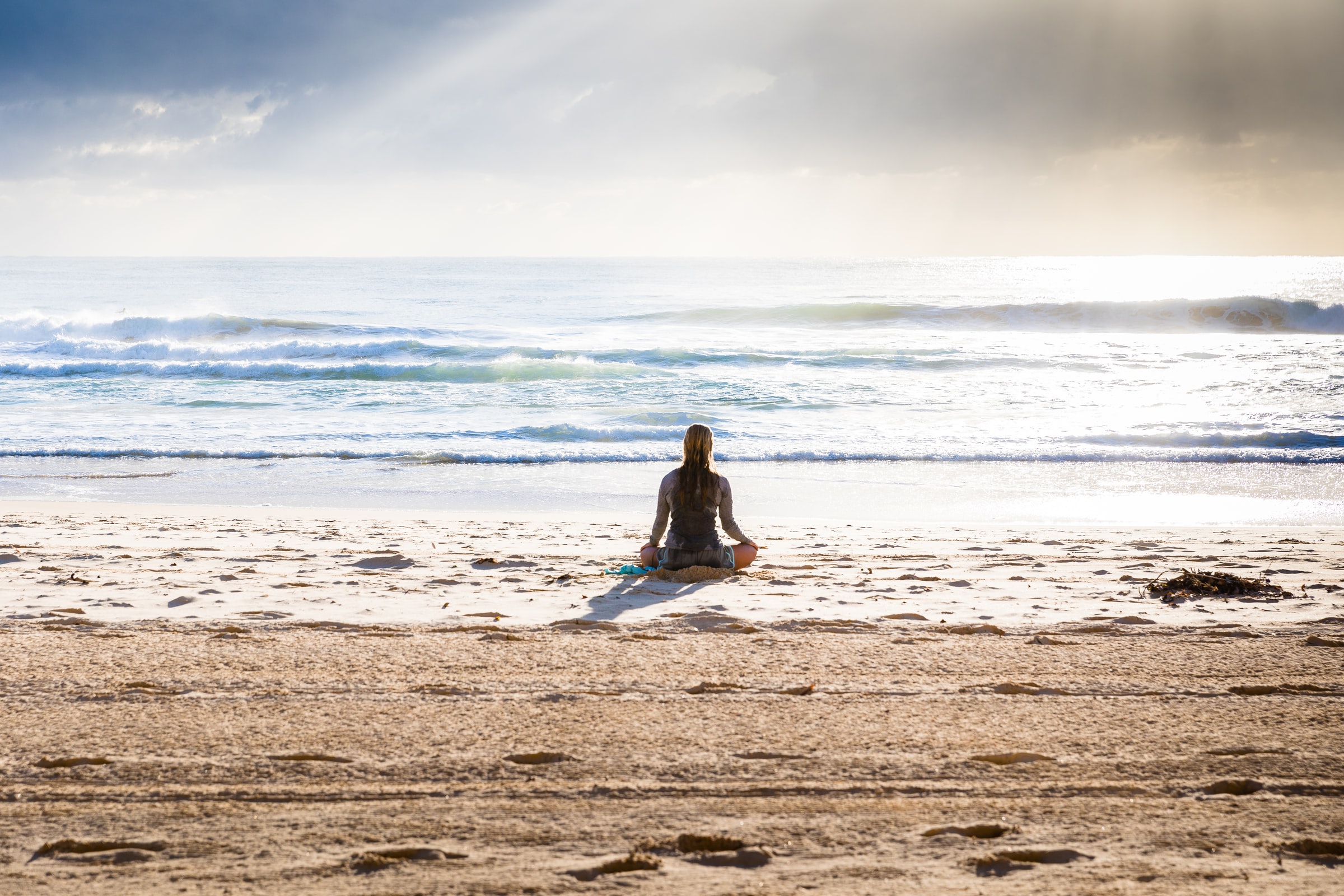 Person sitting in ocean, LifeReignite